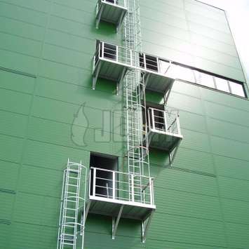 JOMY fire escape ladder. The most economic ladder is the fixed ladder with safety hoops according to regulations. For more then 40 years JOMY makes those ladders and adapts them to each specific situation.