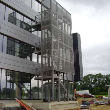 An outside aluminum staircase with clean nice architectural effect