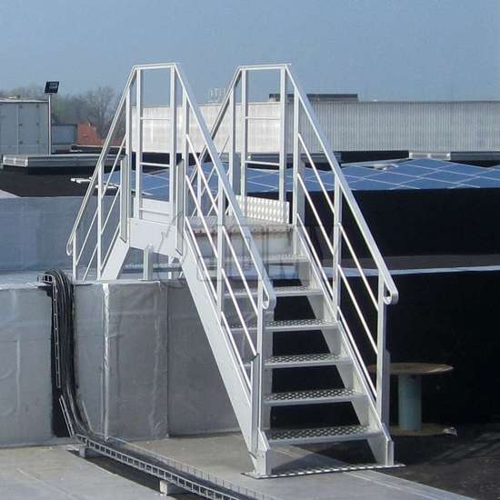 Stair crossover on a factory roof used to cross a wall.