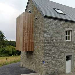 Custom evacuation balcony with wood cladding hidding a drop-down ladder.