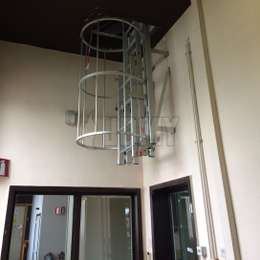 Drop-down cage ladder in a corridor Drop-down cage ladder in a corridor.