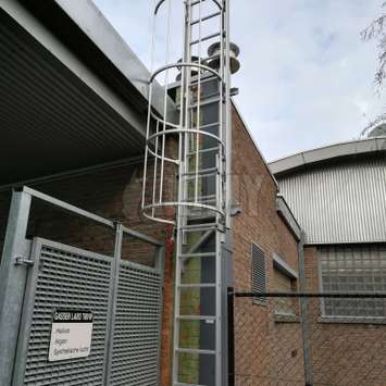 Fixed ladder with undesired access preventing option for use above a pathway.