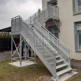 Exterior residential staircase with quarter turn and custom handrails