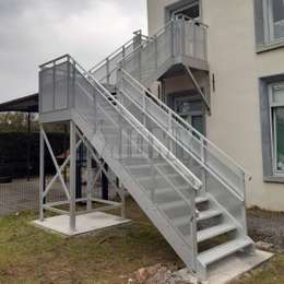 Exterior metal stairs with quarter turn Exterior residential staircase with quarter turn and custom handrails