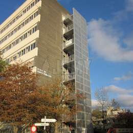 Fire escape staircase in aluminium for an office building.