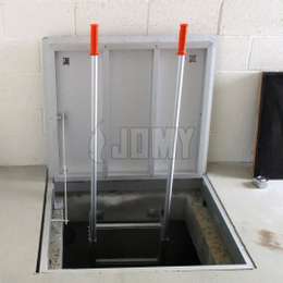 Fixed manhole ladder with 2 telescopic handles and hatch security door.