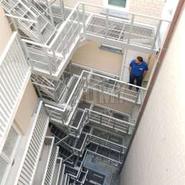 Egress stairs and walkway balconies with gridplates for flats.