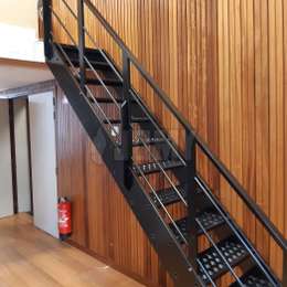Industrial interior stairs in black, with anti-slip treads.