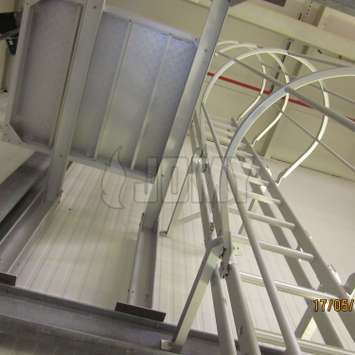 JOMY Caged aluminum ladders are fixed ladder forseen of safety hoops as prescribed by regulators. Our safety cage is also made in anodised aluminum and has a very clean and straight look beside of being strong and thrustworthy. This is the ideal fire ladd JOMY fire escape ladder. The most economic ladder is the fixed ladder with safety hoops according to regulations. For more then 40 years JOMY makes those ladders and adapts them to each specific situation.