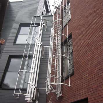 JOMY Caged aluminum ladders are fixed ladder forseen of safety hoops as prescribed by regulators. Our safety cage is also made in anodised aluminum and has a very clean and straight look beside of being strong and thrustworthy. This is the ideal fire ladd JOMY fire escape ladder. The most economic ladder is the fixed ladder with safety hoops according to regulations. For more then 40 years JOMY makes those ladders and adapts them to each specific situation.