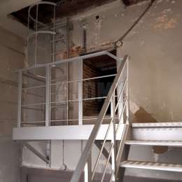 Access walkway platform to the attic and to the fixed ladder leading up to the church tower.