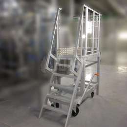 Ship ladder on wheels with a central brake system used for industrial machine access.
