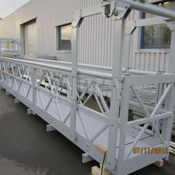 Mobile walkway gantry with suspended cradle - Building Maintenance Unit