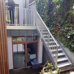 Outdoor balcony staircase with guardrails