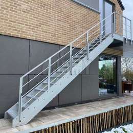 Straight stairs and landing to access the first floor of a home