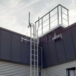 Roof access balcony and ladder with lifeline rail on an office building.